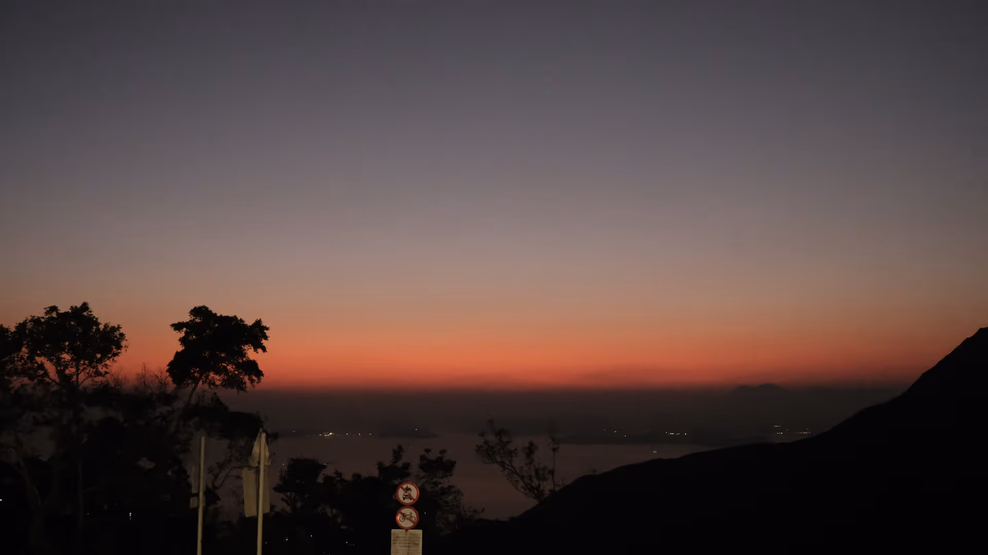 The sky over Hong Kong fading to a deep red afterglow after sunset, seen from Victoria Peak.